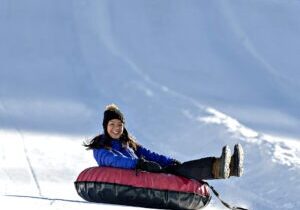 The Palisades Tahoe tubing hill is fun for both children and adults.